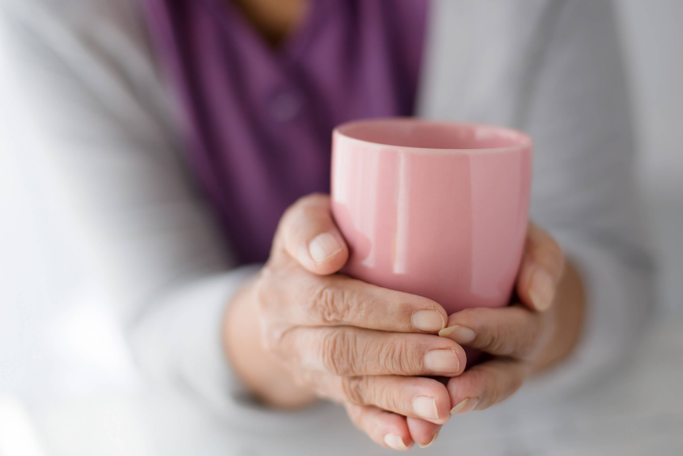 Person holding a mug