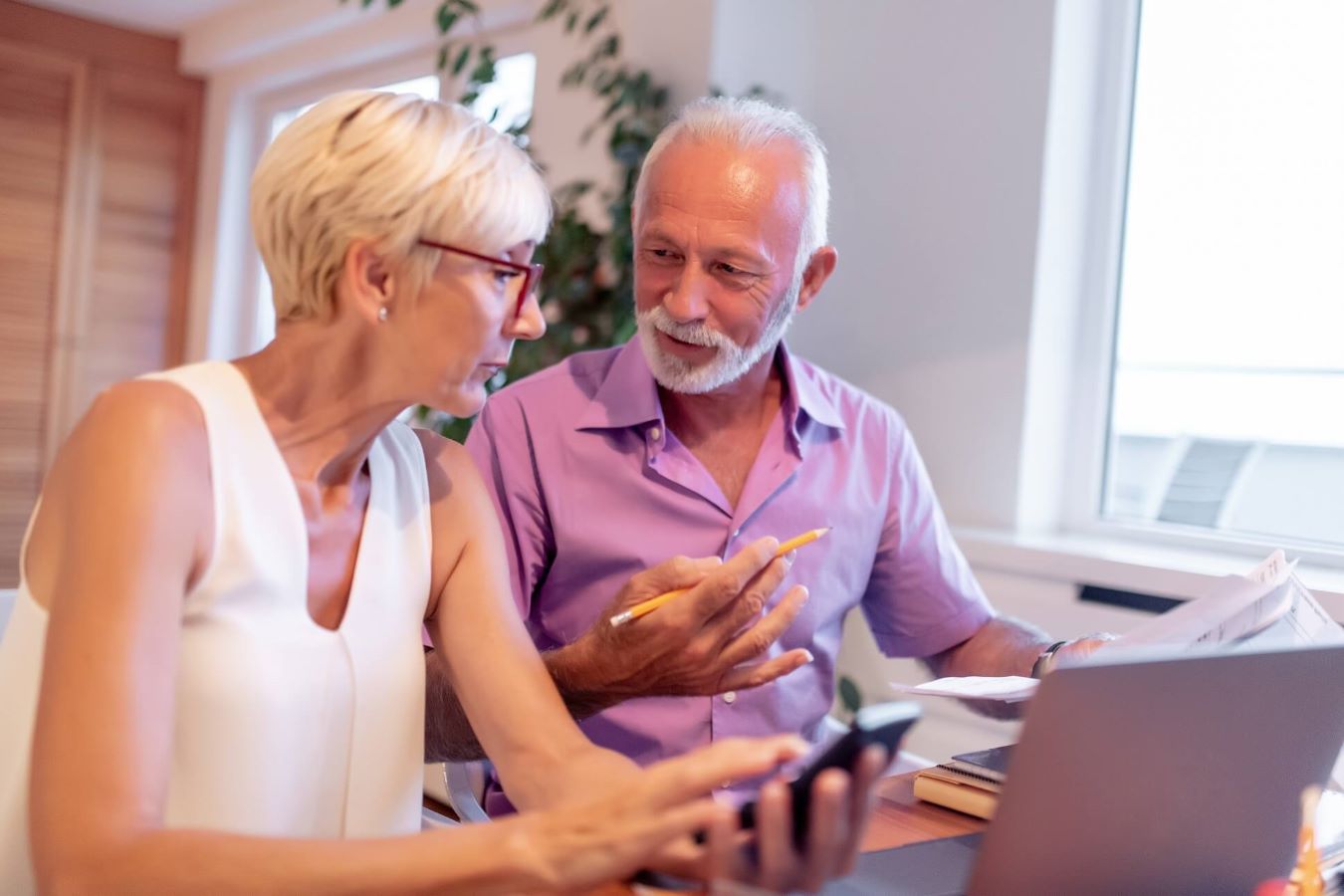 Customer couple looking at laptop