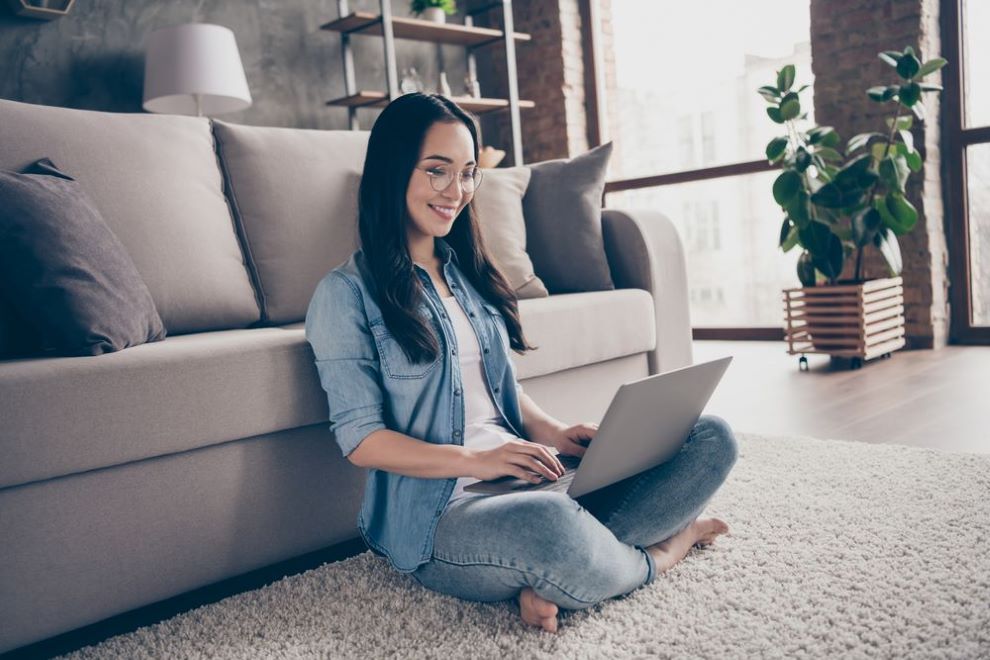 Woman on laptop cross-legged