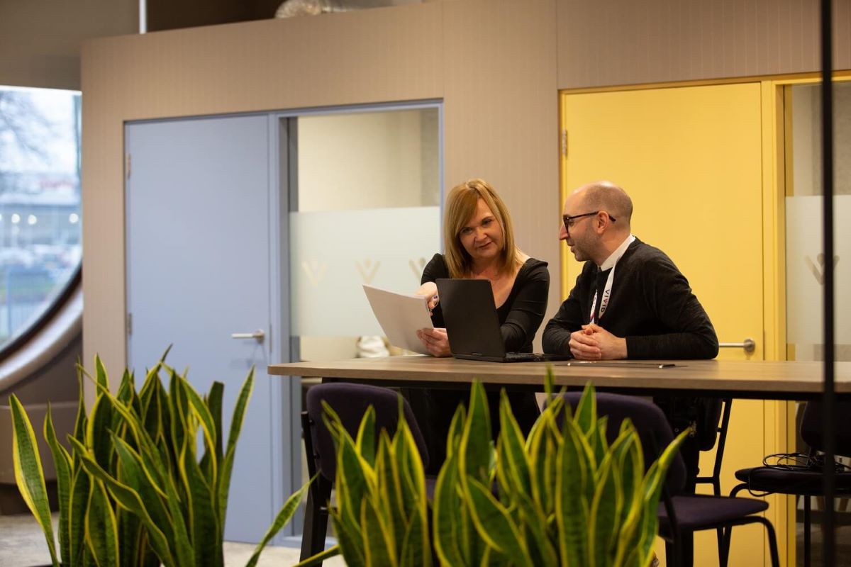 Staff talking in office