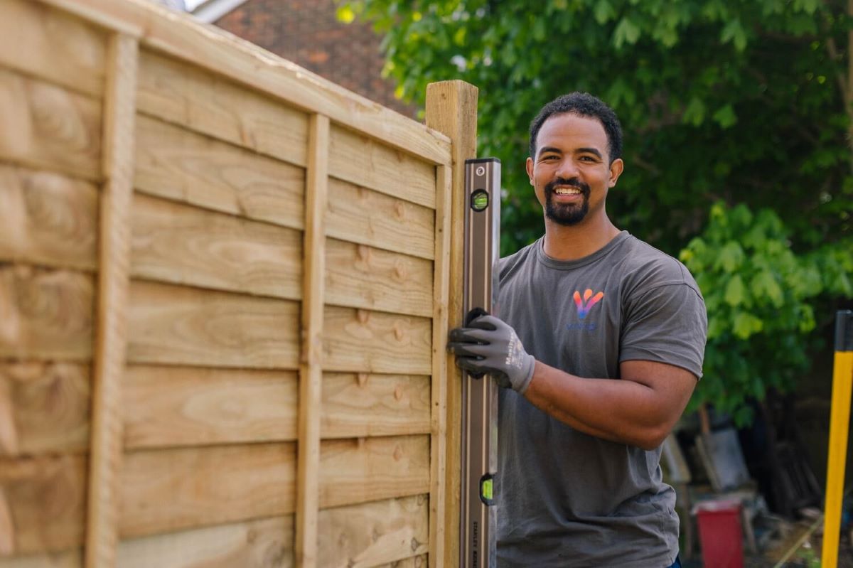 Trade staff person with a fence