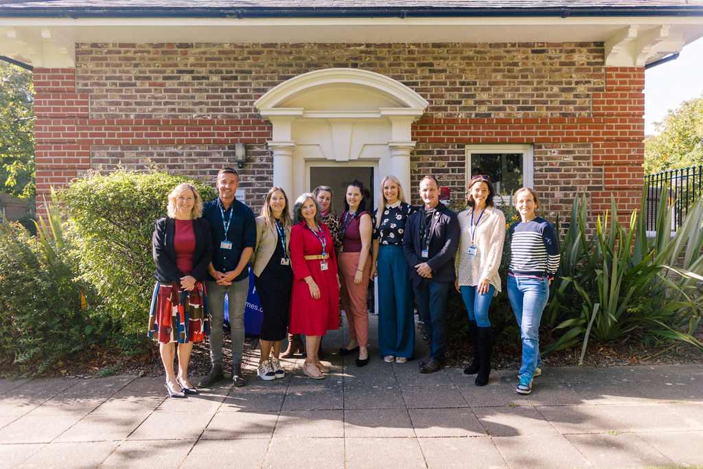 Photo of You Trust staff in front St Mary's Community Room