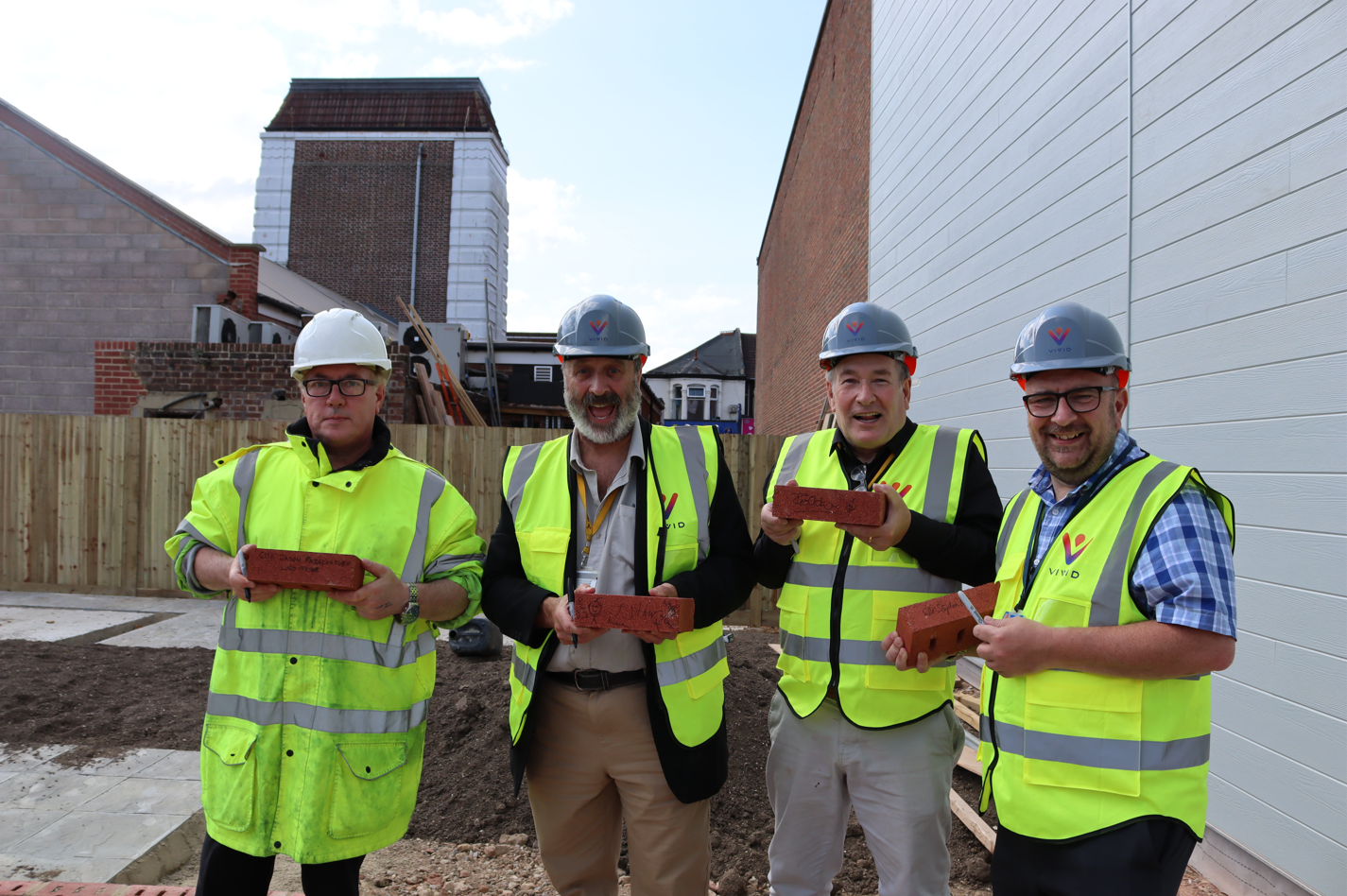 Councillors Fazackerley, Hunt, Adair and Pitt holding their bricks at Odeon development North End Portsmouth