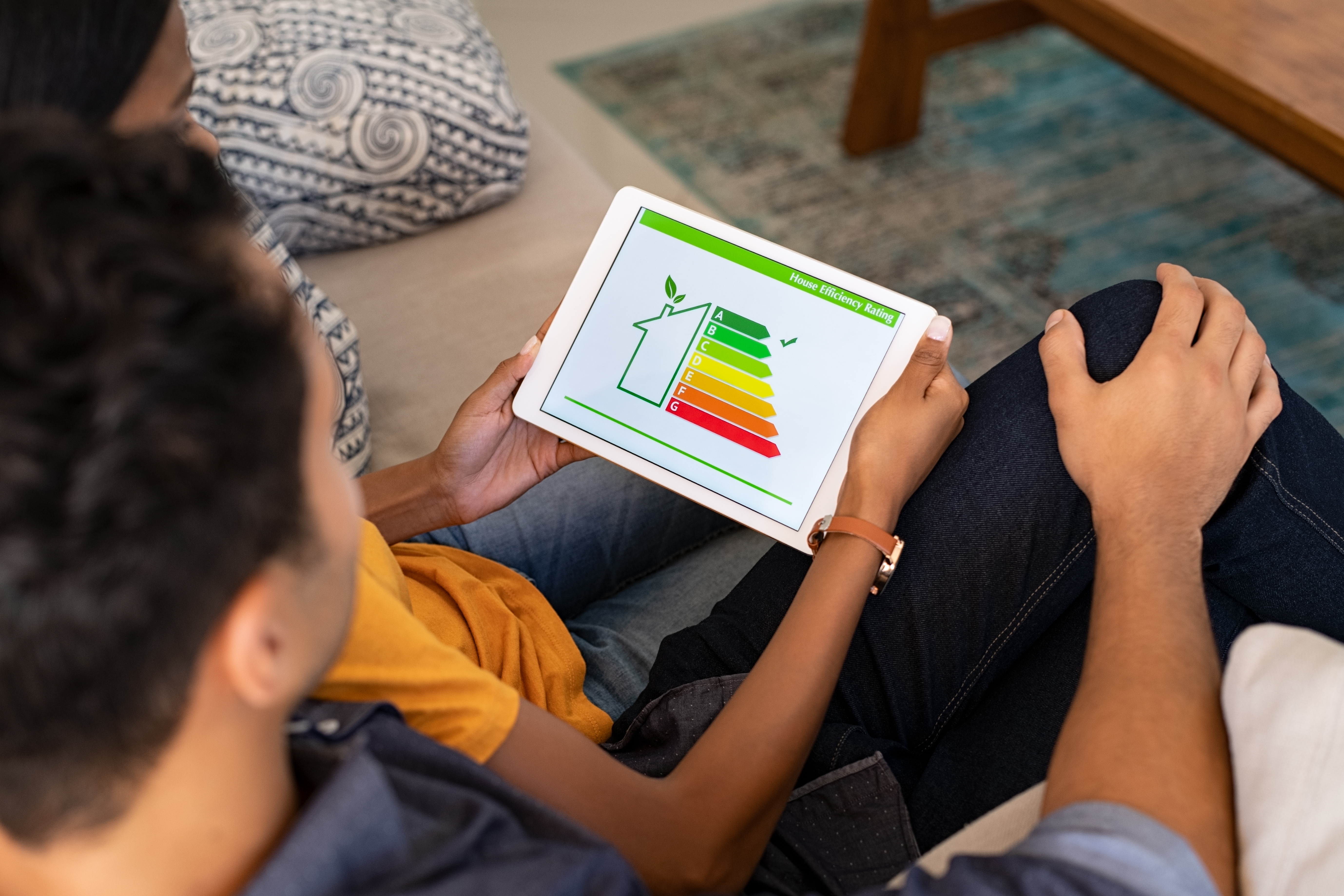 couple looking at energy efficiency rating on tablet