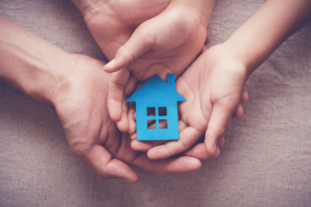 hands holding home cut out