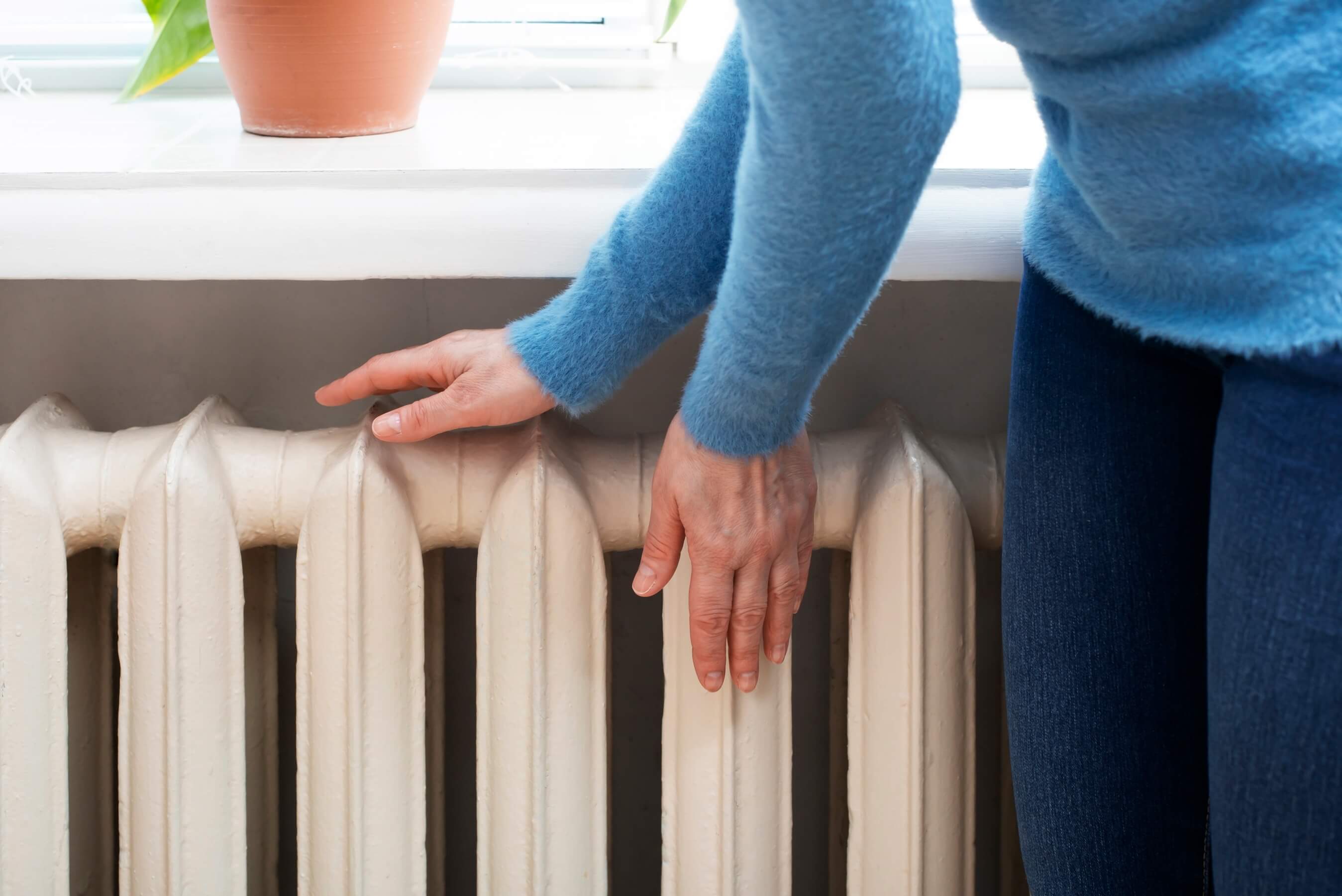Person touching a radiator
