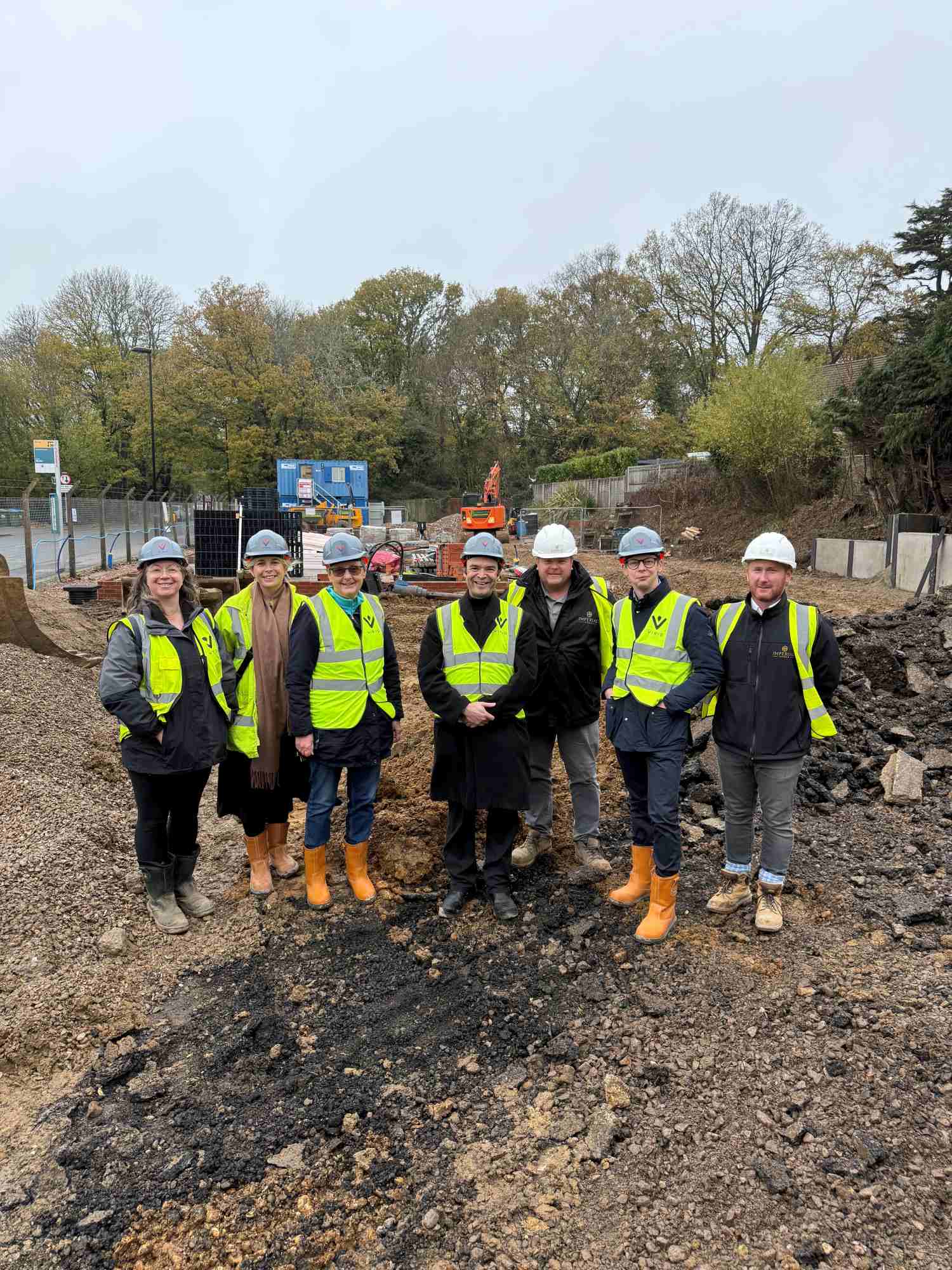 People stood on building site