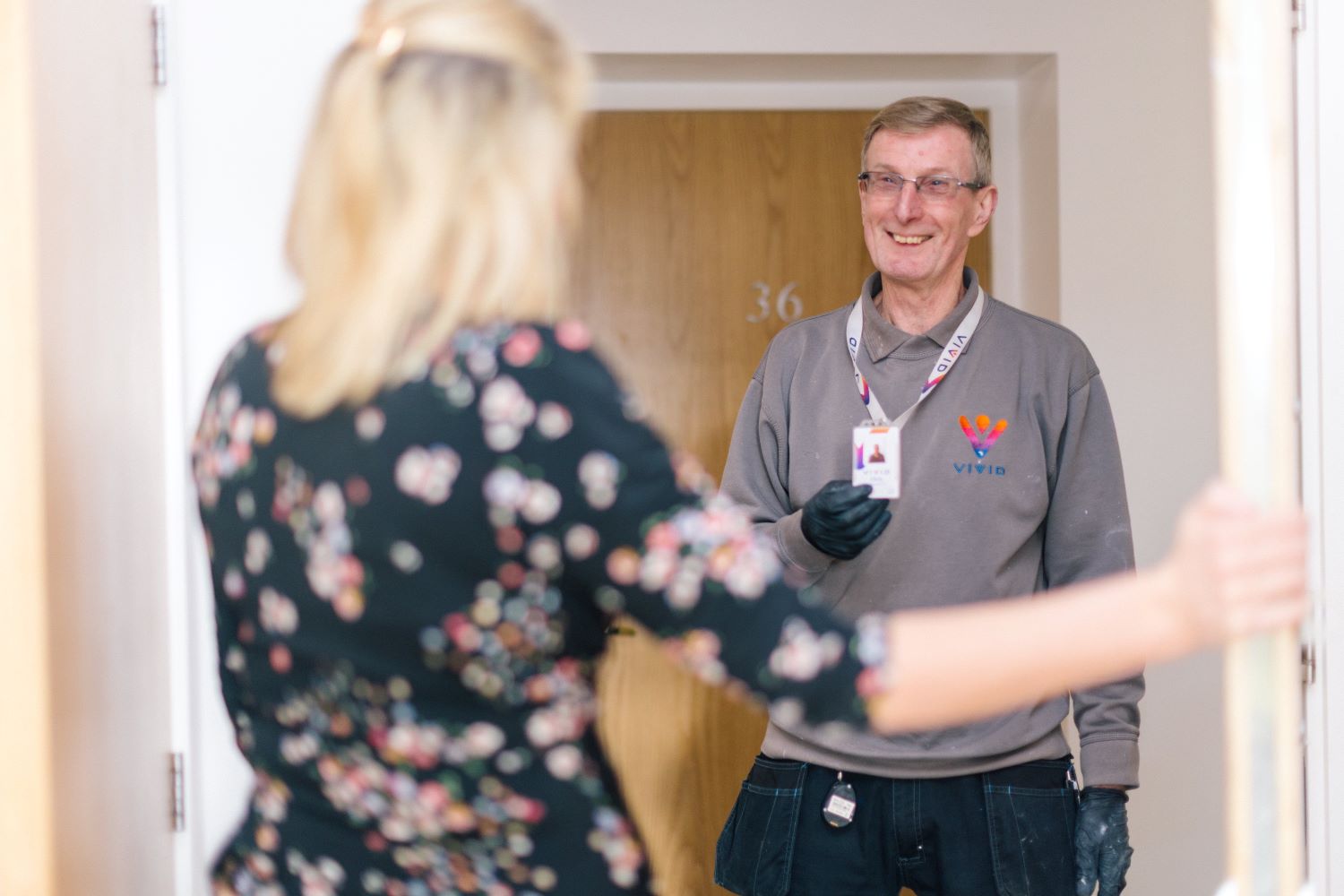 VIVID staff member showing their badge