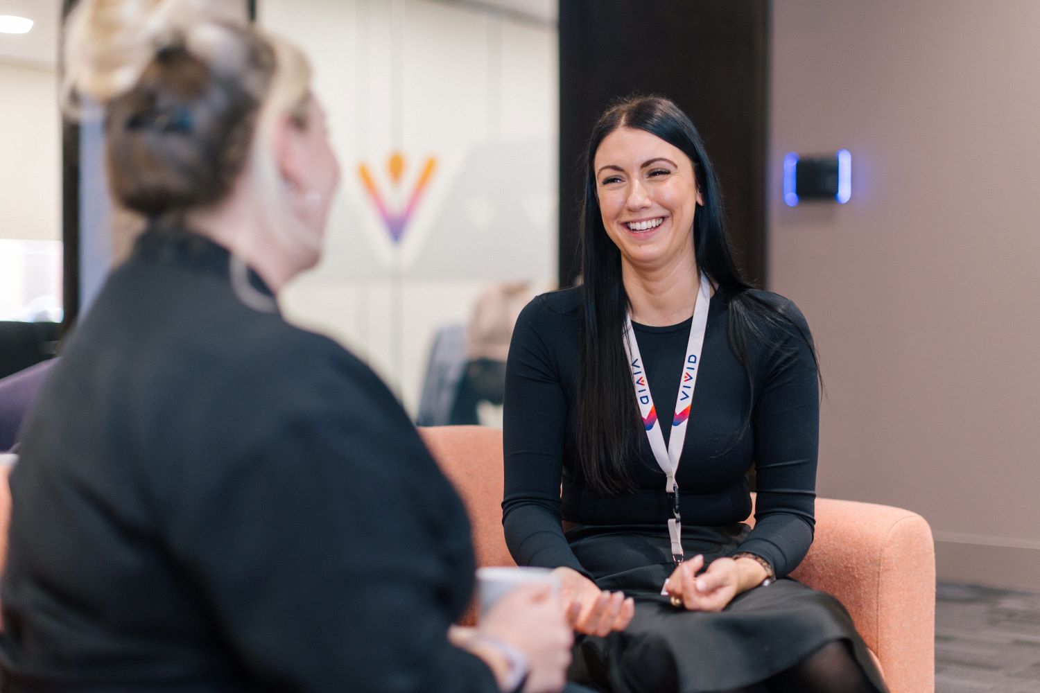 Staff member talking and smiling