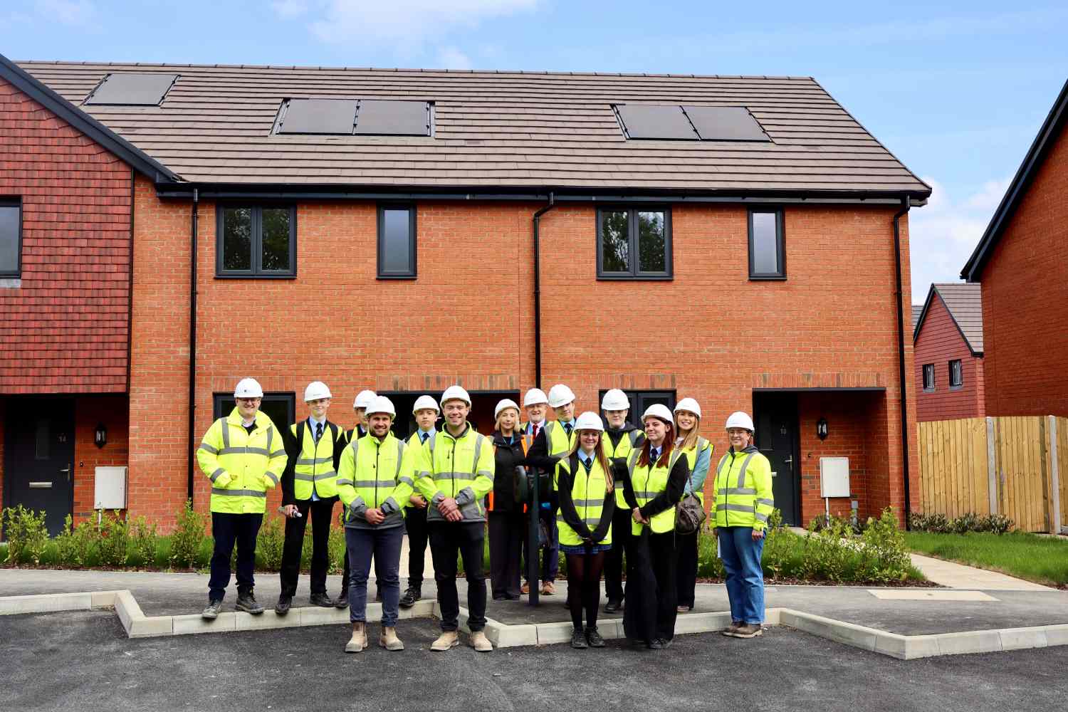 People stood outside house